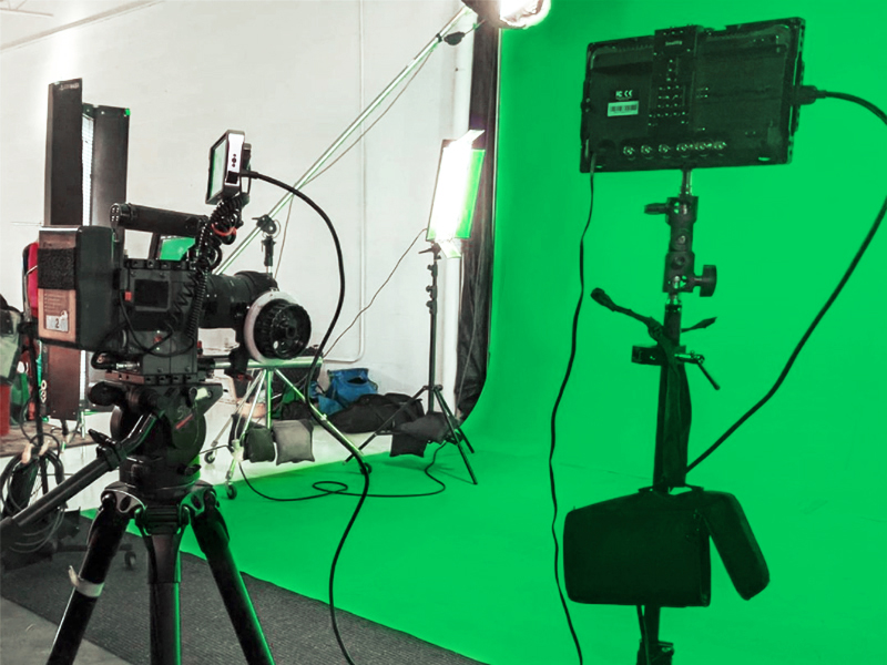a picture of green screen with kino flo lights camera recording